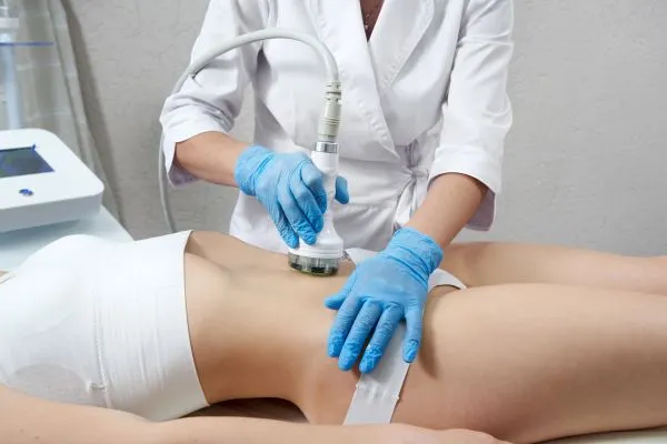 Lost the Weight but Not the Loose Skin? 2 woman having HIFU treatment on her stomach to combat loose skin Sandwich following weight loss